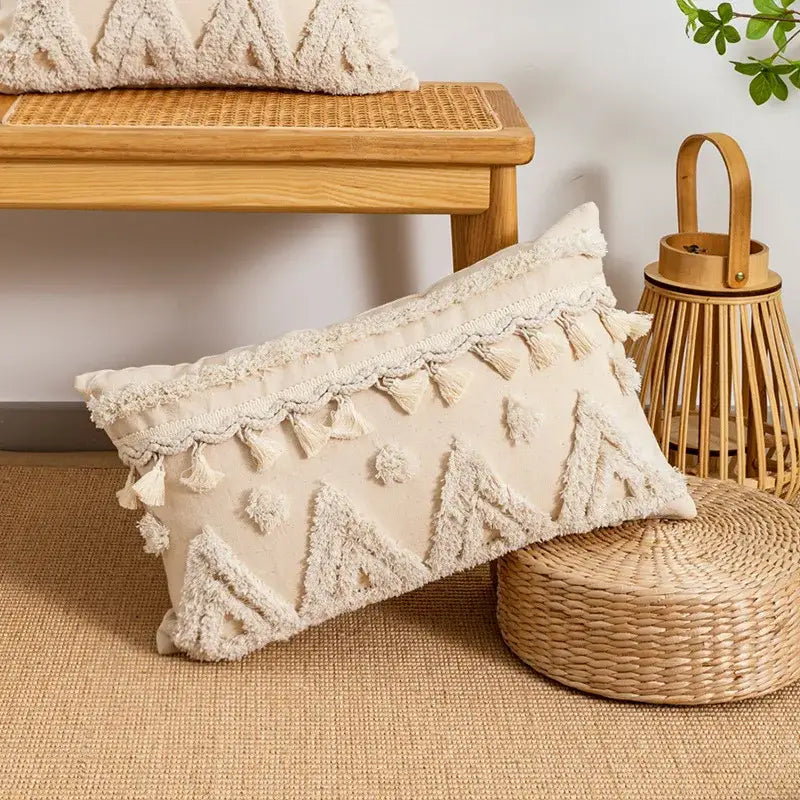 Cream-colored boho tufted embroidered cushion cover with textured triangles and tassel trim for living room decorbites boho tufted pillow