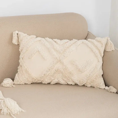 Cream-colored boho tufted embroidered cushion cover with textured fringed fabric and tassels for living room decorbites decor