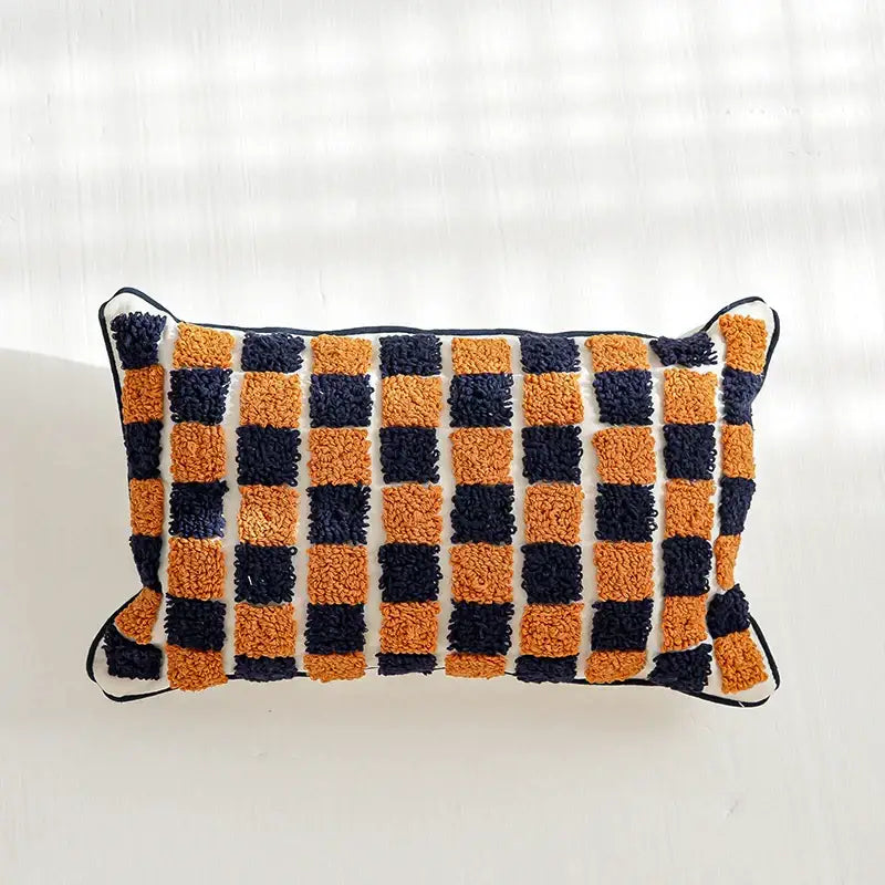 Rectangular boho tufted pillow cover with plush checkered pattern in navy and burnt orange for living room decor by decorbites