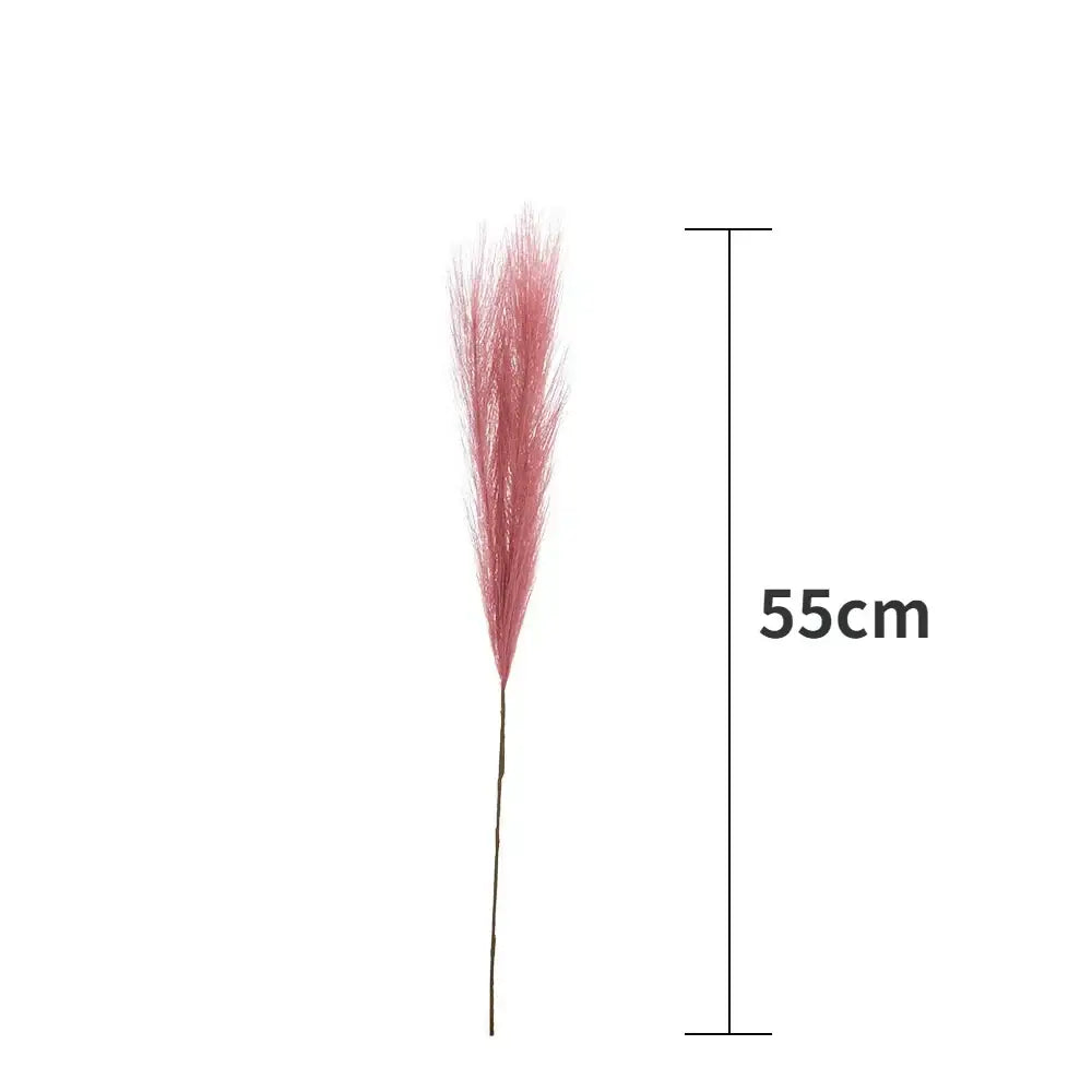 A 55cm tall artificial pink feather grass stem with a dark green stalk for boho white beige fluffy pampas grass decorbites
