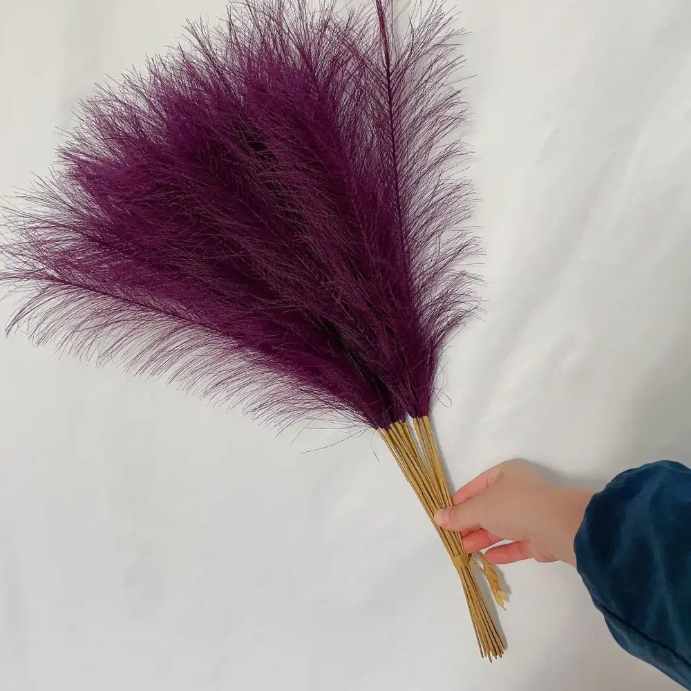 A bundle of vibrant purple fluffy pampas grass with feathery plumes and natural bamboo stems for decorbites fluffy pampas decor