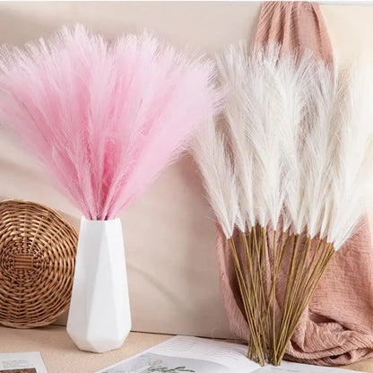 Pink and white fluffy pampas grass bundles in a modern white geometric vase for boho living room decorbites pampas grass