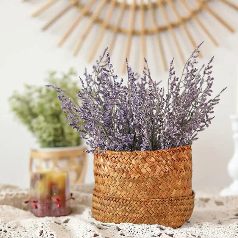 A boho woven wicker basket filled with dried lavender and pink and white decorbites forever dancing grass flowers