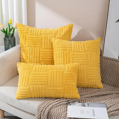 Three vibrant yellow boho textured plush throw pillow covers arranged on a cozy sofa for living room decor