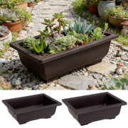 Dark brown rectangular ceramic plant pot filled with green and purple succulents para plantas outdoor use