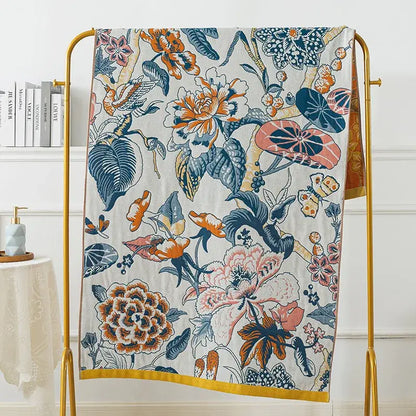 A vibrant botanical blue and orange cotton gauze bath towel with floral pattern for decorbites cotton gauze bath use