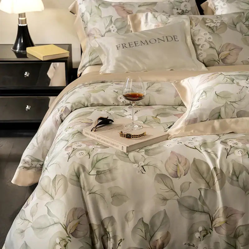 Elegant cream-colored satin egyptian cotton print bedding set with botanical leaf and flower patterns in soft tones