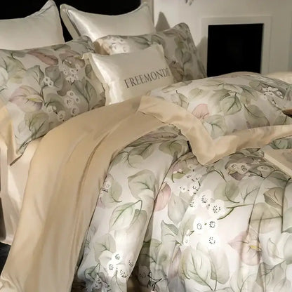 Elegant cream-colored bedding set in egyptian cotton featuring a botanical print in soft greens and blush pinks