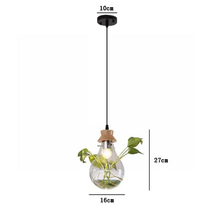 Clear glass pendant light with wooden cap and hanging green plant inside for decorbites botanical glass bottle pendant light