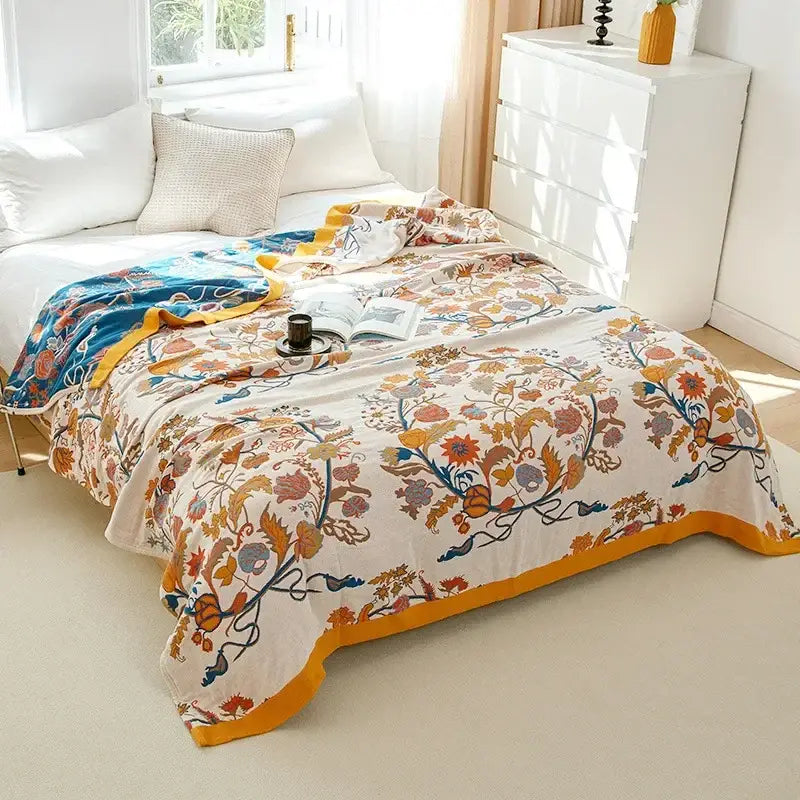 A cream decorbites cotton leisure blanket with vibrant floral pattern and embroidered border for bedroom decor