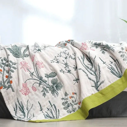 Off-white decorbites cotton leisure blanket with delicate pink green botanical print and vibrant lime green border