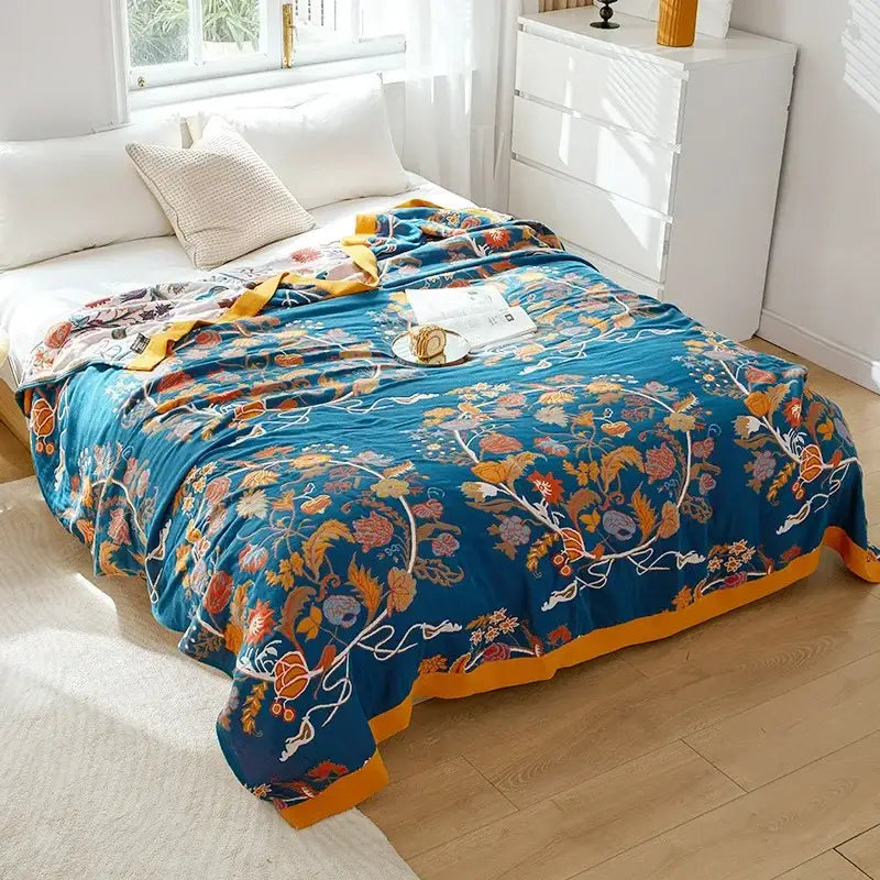 Vibrant blue decorbites cotton leisure blanket with floral patterns and mustard-yellow border for bedroom use