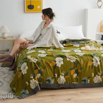 Olive green floral bedspread with white and yellow blossoms and dark gray border in decorbites cotton leisure blanket