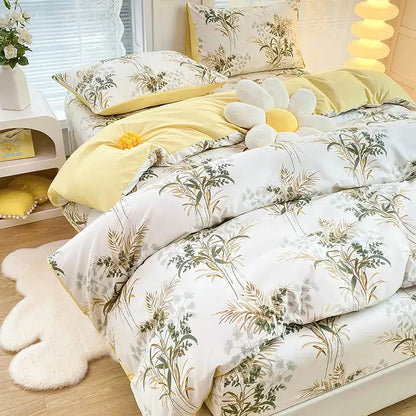 Yellow and white floral duvet cover set with green and gold botanical prints for bedroom bedding