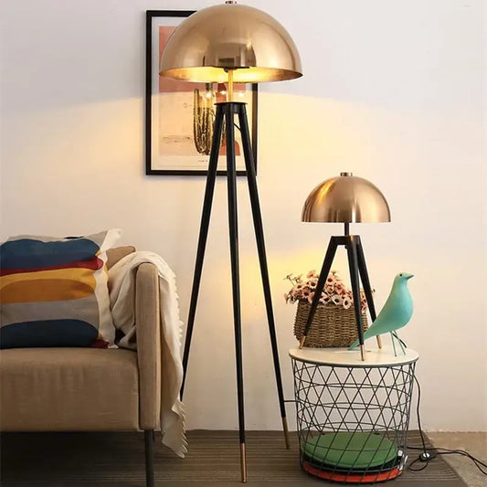 Brass and black decorbites coyote gold tripod floor lamp with brass dome shade and warm glowing light for living room decor