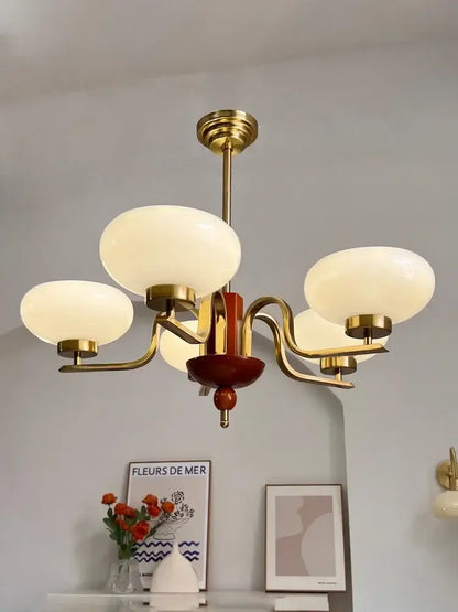 Vintage-style brass and cream glass pendant chandelier with five frosted glass shades for dining room decorbites cream glass