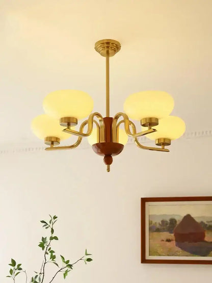 Brass and cream glass pendant chandelier with frosted shades five-light design for dining room decorbites cream glass