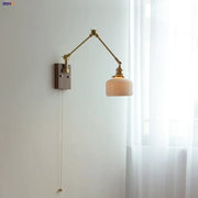 Brass and ribbed glass ceramic led wall light with adjustable brass finish and pull-chain switch for bedroom sconce decorbites ceramic led