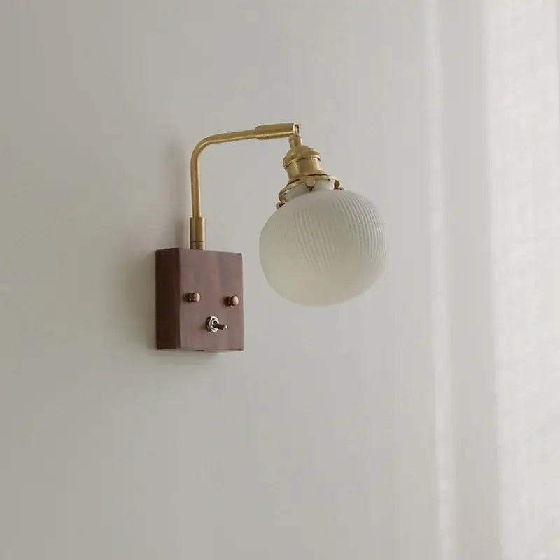 Vintage brass and walnut ceramic led wall light with off-white ribbed glass globe for bedroom decorbites ceramic led wall