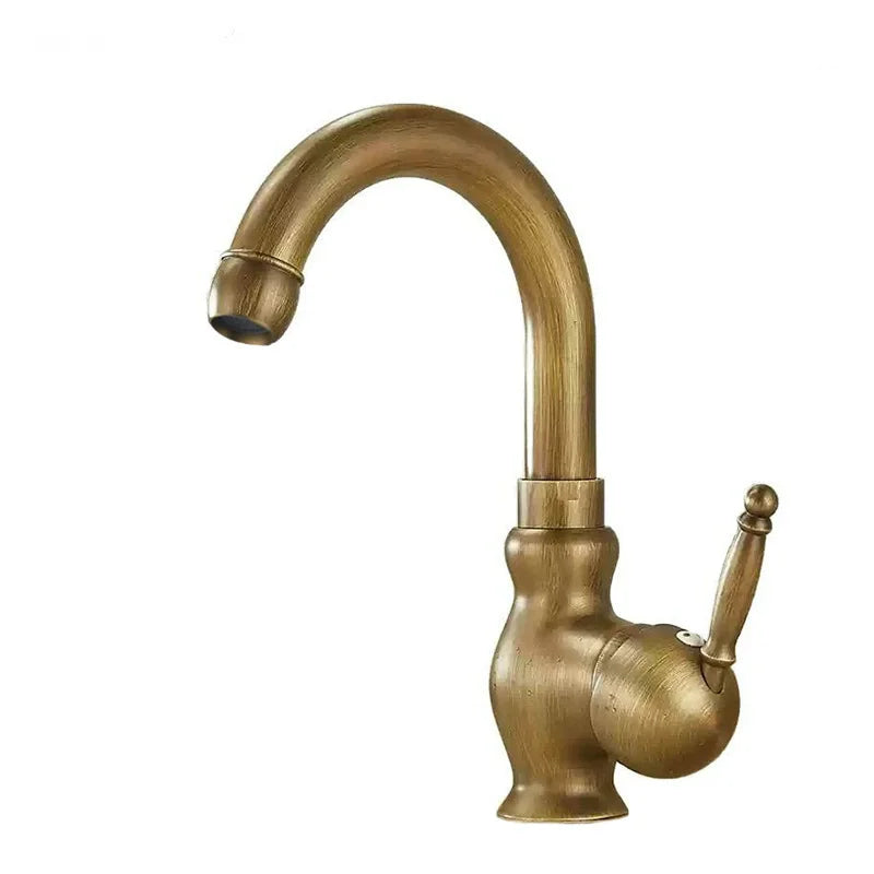 Antique brass bathroom sink faucet with curved spout and ornate handle in brass finish for kitchen or bathroom use