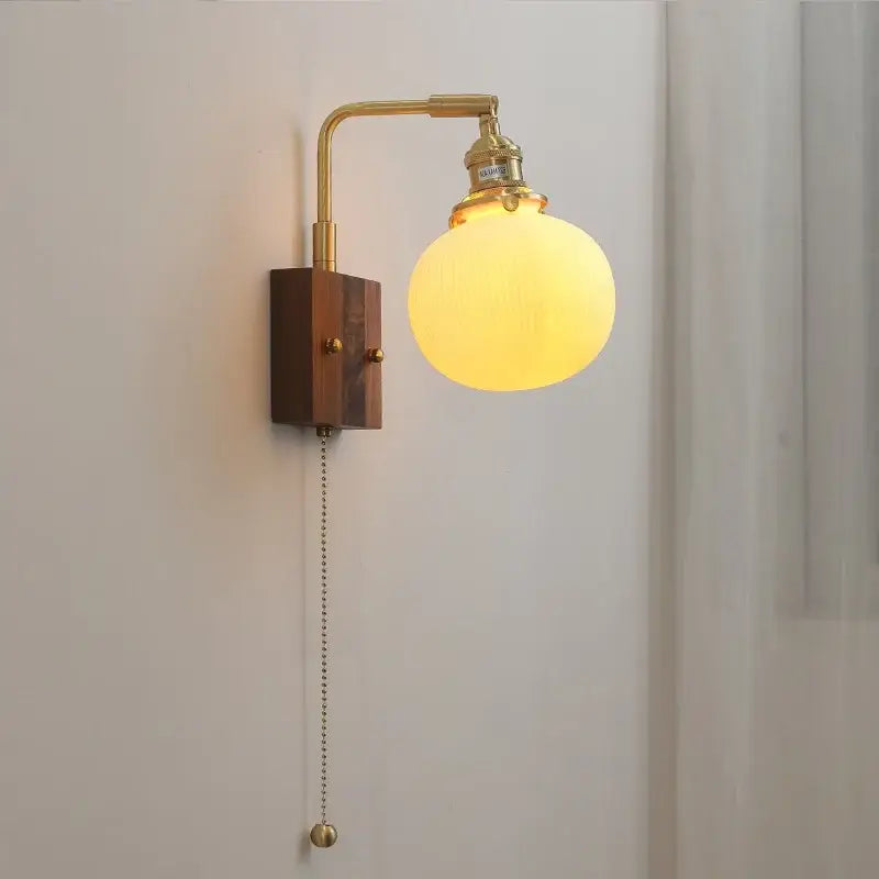 Brass ceramic ball led wall light with warm yellow opal glass globe and wooden base for living room wall light
