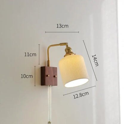 Vintage-style brass wall light with ceramic ball, wooden base, and cream ribbed fabric shade for living room led wall light