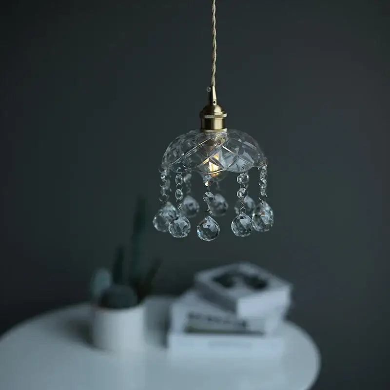 A delicate brass pendant light with clear glass led crystals and faceted beads for dining room decorbites decor