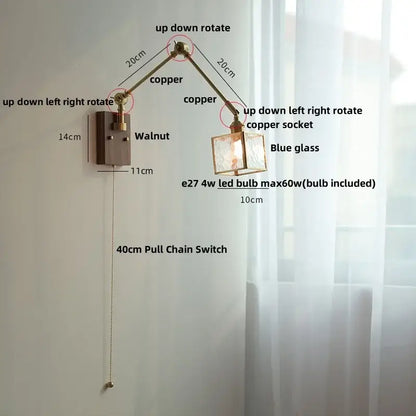 Adjustable copper wall sconce with blue glass shade and walnut-finished decorbites ash wood mounting plate for bedroom lighting