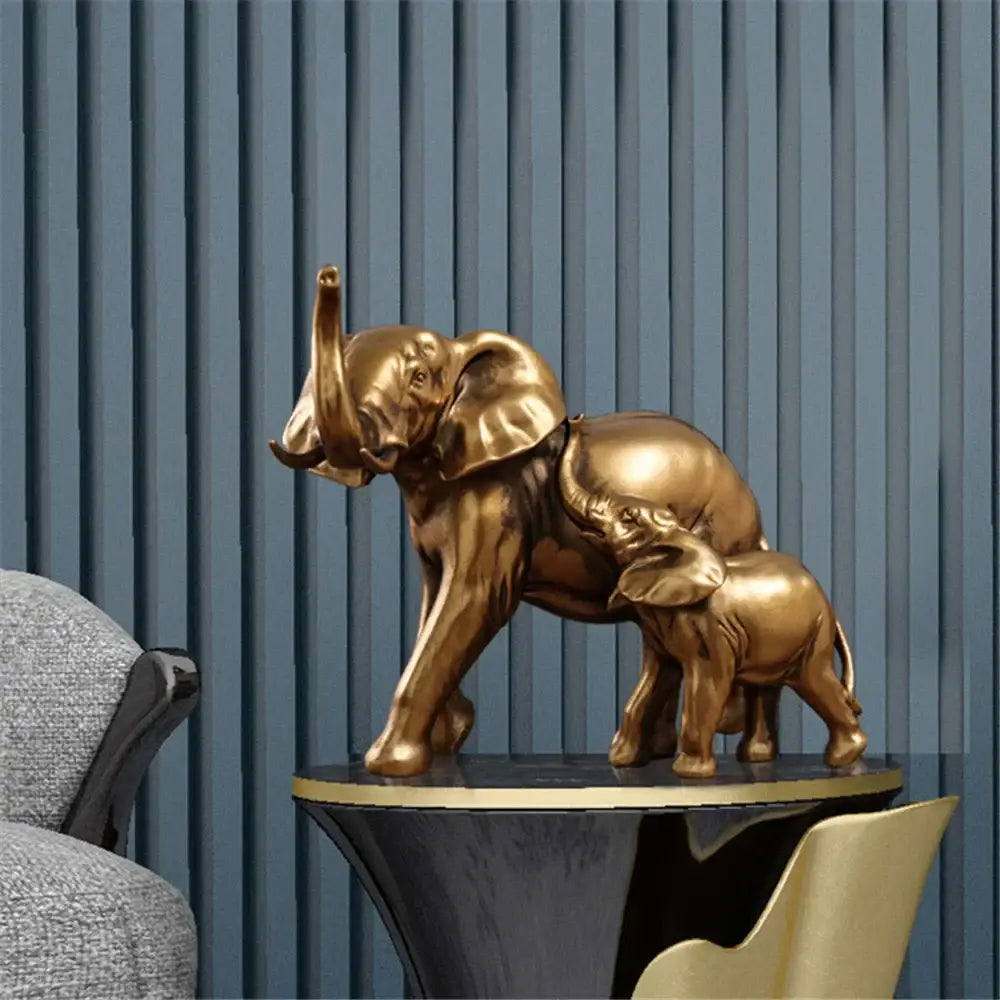 Golden brass elephant art decor sculpture featuring mother and calf on black pedestal for living room by decorbites elephant