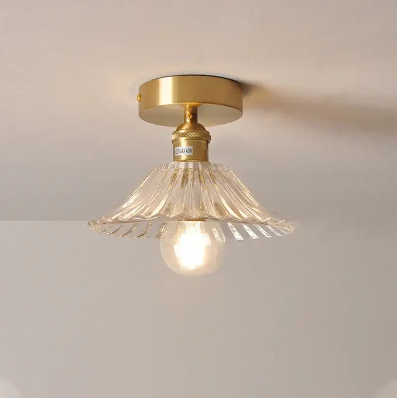 Gold-finished ceiling lamp with clear fluted glass shade pendant and exposed bulb for kitchen lighting