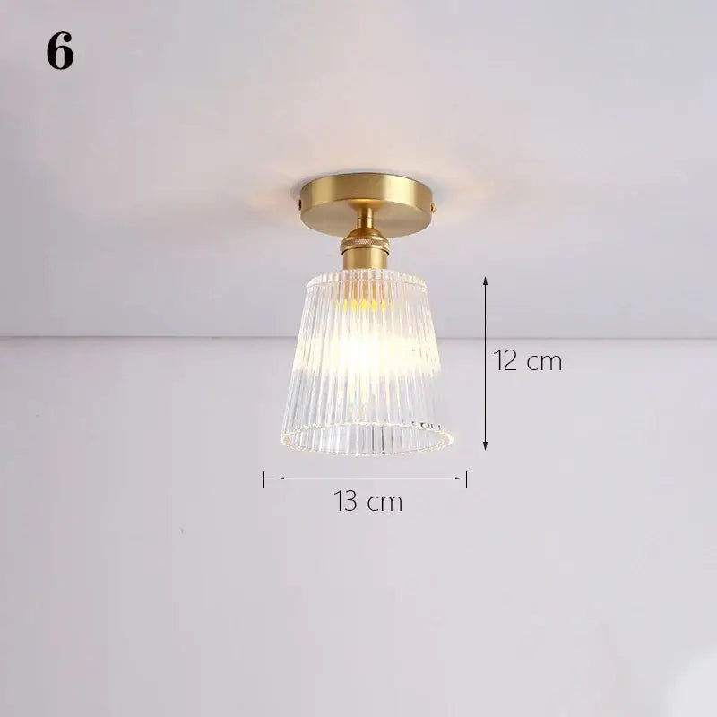 Gold-toned ceiling lamp with clear vertically ribbed glass shade pendant for kitchen lighting use