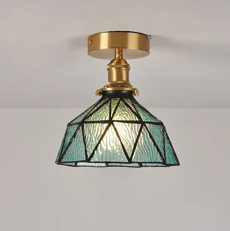 Teal glass shade pendant ceiling lamp with brass fixture and geometric leaded design for kitchen lighting