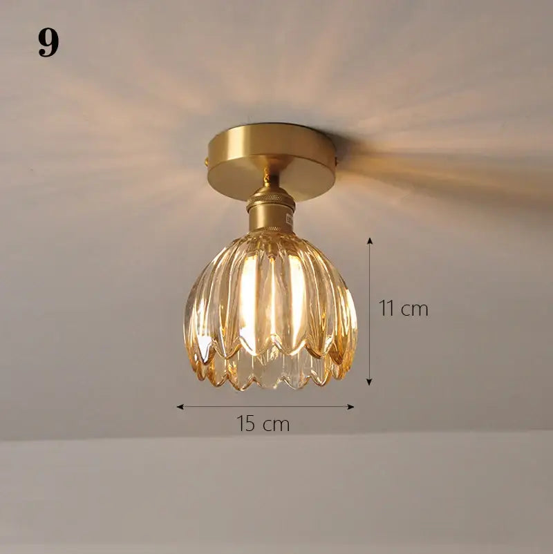 Vintage-style ceiling lamp with gold metal base and amber faceted glass shade pendant for kitchen lighting