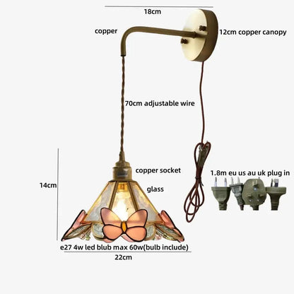 Brass orange butterfly stained glass wall light fixture with copper and glass featuring pink peach and amber hues