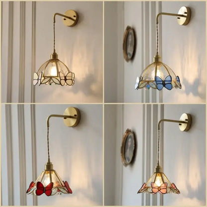 Brass orange butterfly stained glass wall light fixture with curved arm and brass hardware for bedroom sconce use