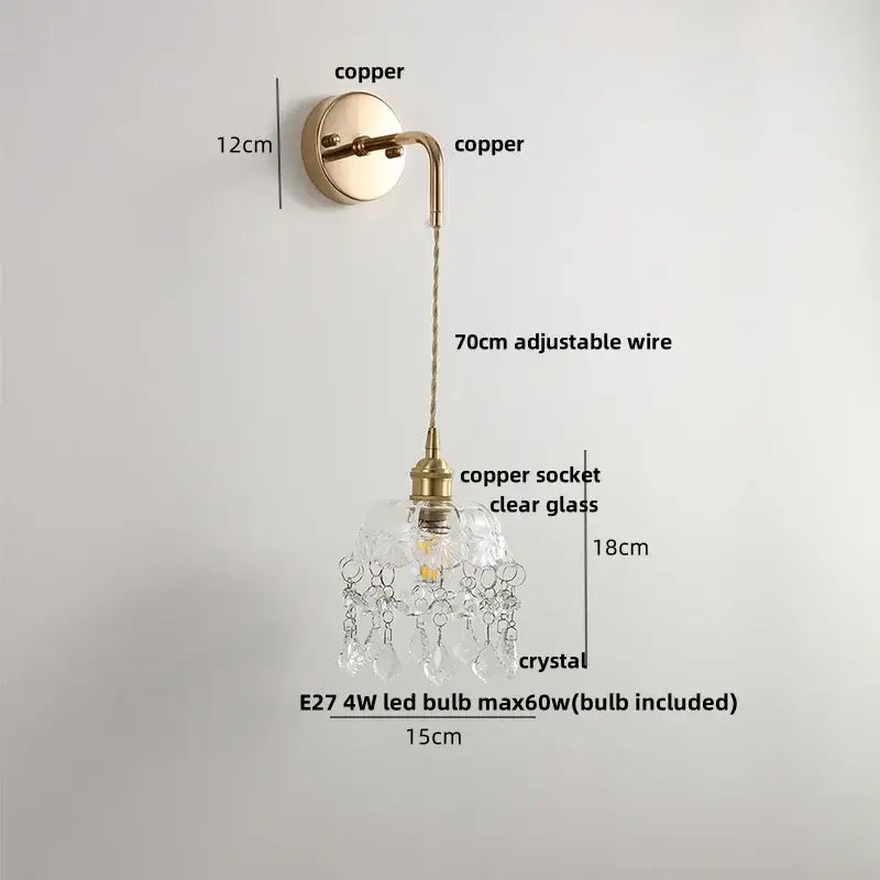 A delicate copper brass petal glass decorbites adjustable led wall light with clear shade and crystal droplets for bedroom decor