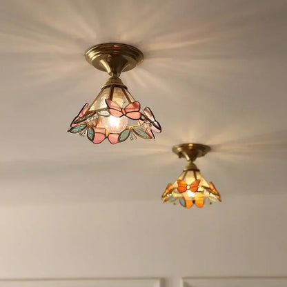 Delicate brass red butterfly glass led ceiling light with stained glass butterflies in soft pink and orange hues for decorbites decor