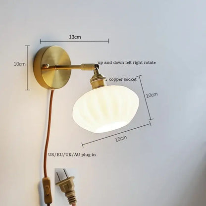 Brass-finished ceramic led wall sconce with adjustable frosted glass shade for bedroom mirror lighting decorbites ceramic led