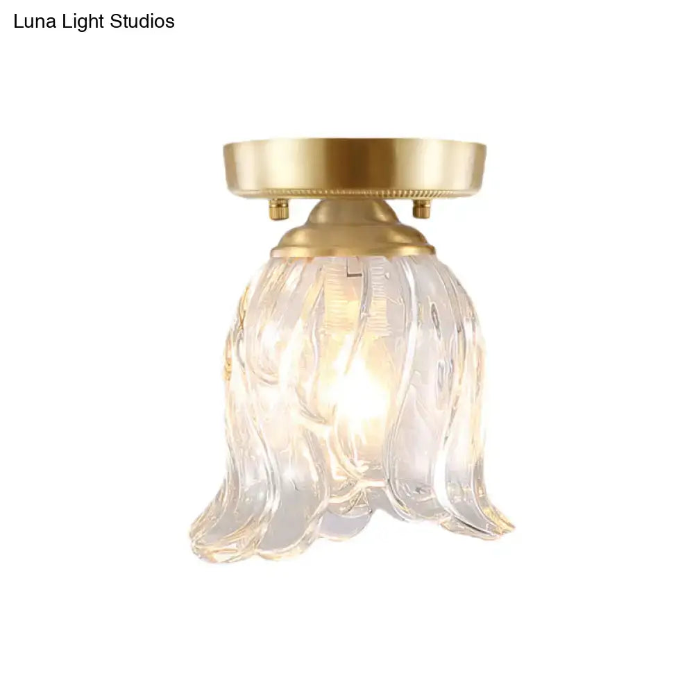 Decorbites brass semi flush mount light with clear ripple fluted glass cone flower design and gold metal base