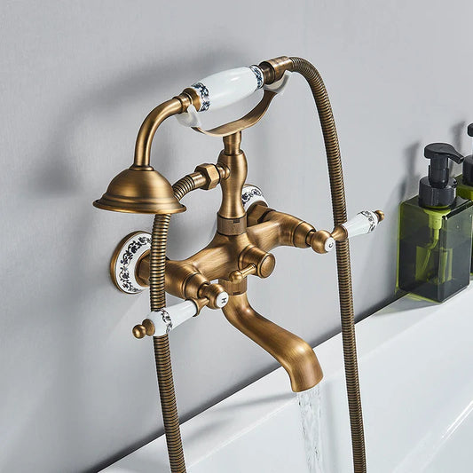 Antique brass shower faucet wall mount with white ceramic handles featuring black floral patterns and cold water control