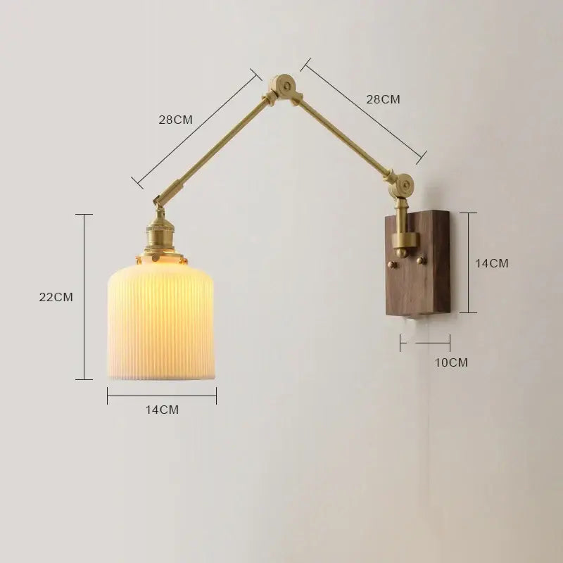 Adjustable brass wall sconce with copper swing arm led and ribbed glass shade mounted on a walnut wooden plate