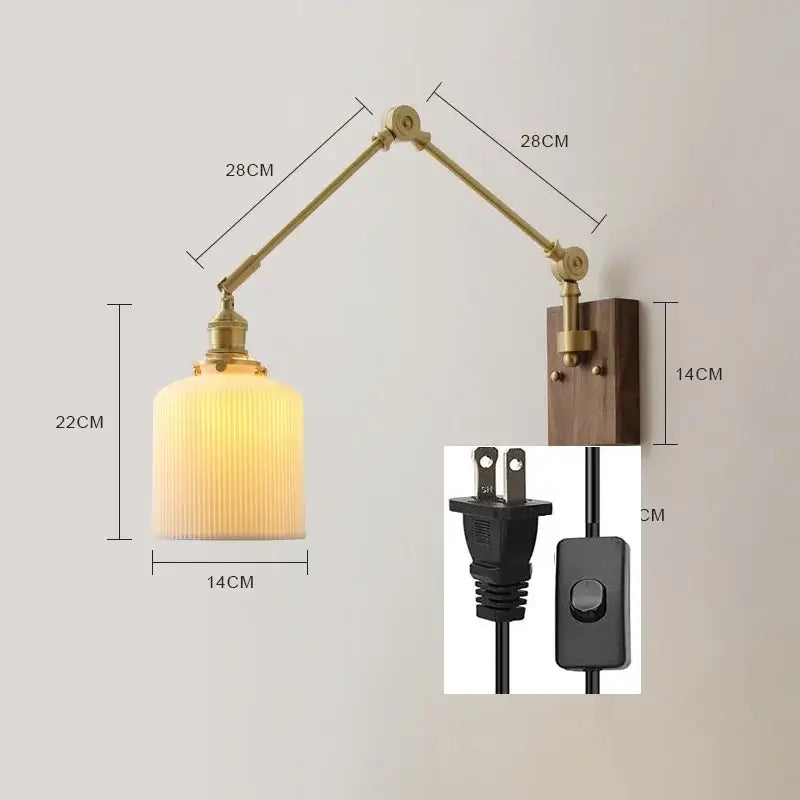 Brass and walnut copper swing arm led wall sconce with adjustable brass finish and ribbed warm glass shade mounted on wood