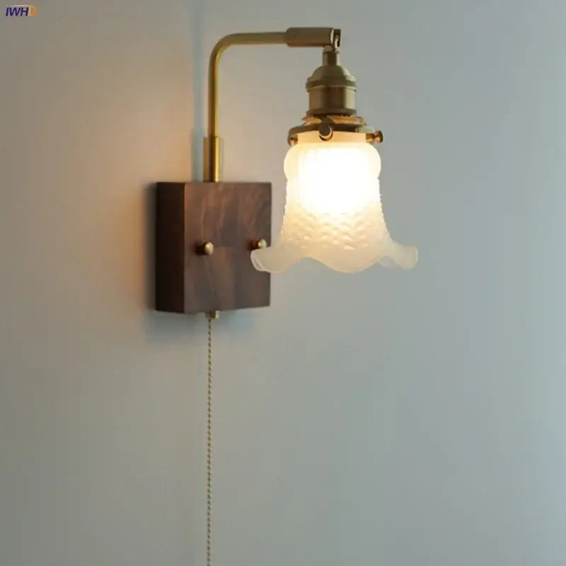 Brass walnut wood wall sconce with brass finish, dark wood base, and off-white textured glass shade by decorbites brass walnut