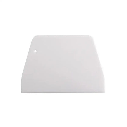 White plastic cake spatula dough scraper with rounded edge and hole for decorbites cake spatula dough use