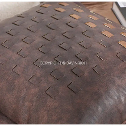 Brown leather cushion cover with woven tan rectangular accents featuring brighton cross stitch design for living room