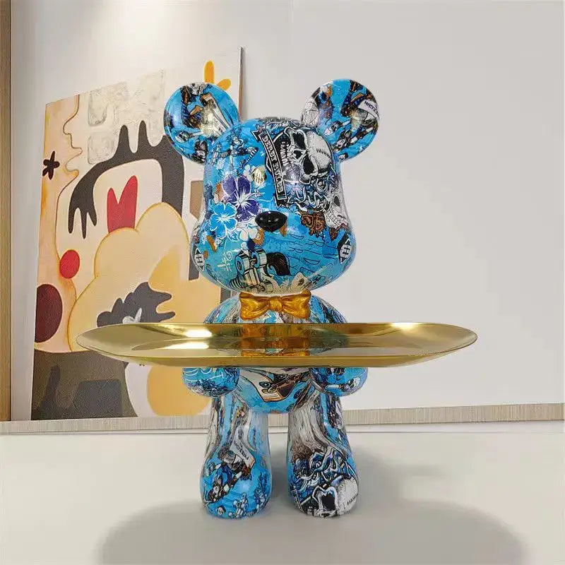 Blue vinyl bear figurine with british flag floral graffiti design gold bow tie holding golden tray for key storage decorbites graffiti bear