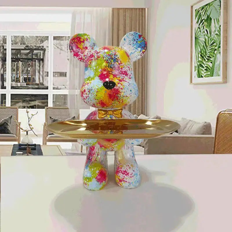 Colorful splatter-painted bear figurine with glossy finish and gold bow tie holding tray for living room decorbites graffiti bear
