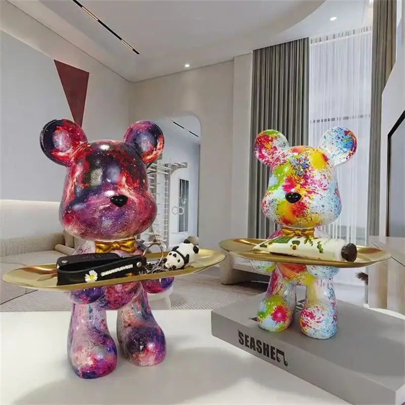 Two vibrant galaxy-themed decorbites graffiti bear figurines with glossy resin finish and colorful splatter paint design