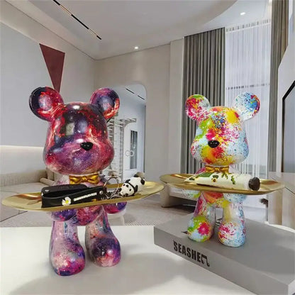 Two vibrant galaxy-themed decorbites graffiti bear figurines with glossy resin finish and colorful splatter paint design