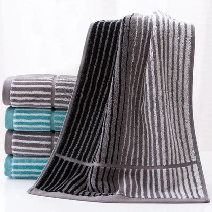 A british style sports fitness towel with turquoise gray stripes and soft terry cloth texture for gym use